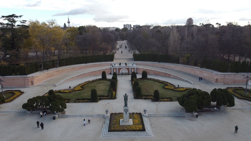 an aerial view of a park with a fountain