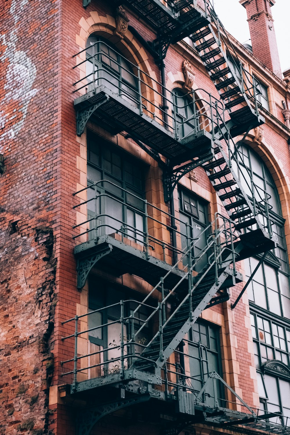 a fire escape on the side of a brick building