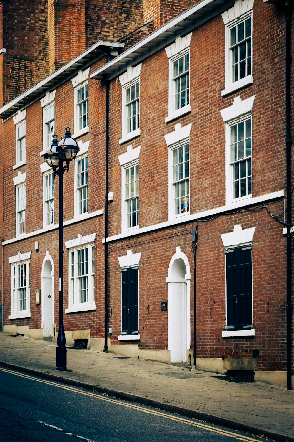 a row of brick buildings on a city street