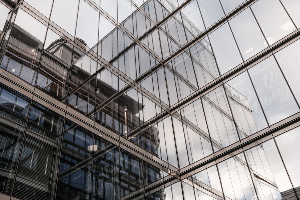 the reflection of a building in the windows of another building