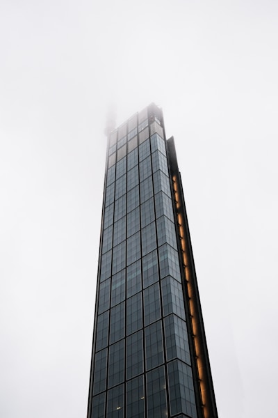 a very tall building with a clock on it's side