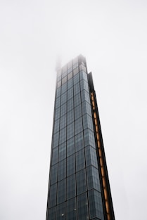 a very tall building with a clock on it's side