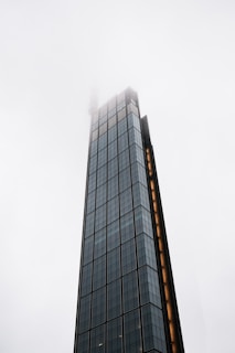 a very tall building with a clock on it's side