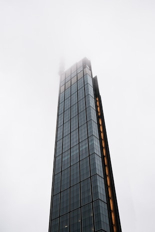 a very tall building with a clock on it's side