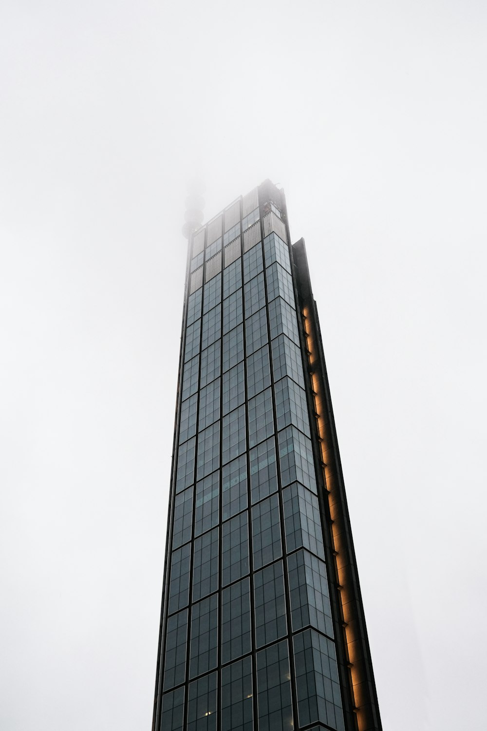 a very tall building with a clock on it's side