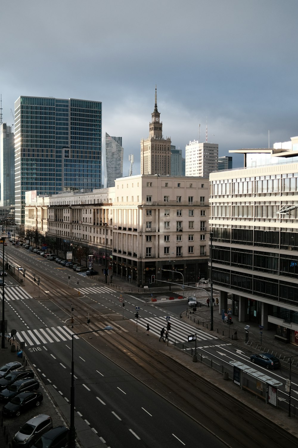 a view of a city street with tall buildings