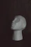 a white mannequin head sitting on a table