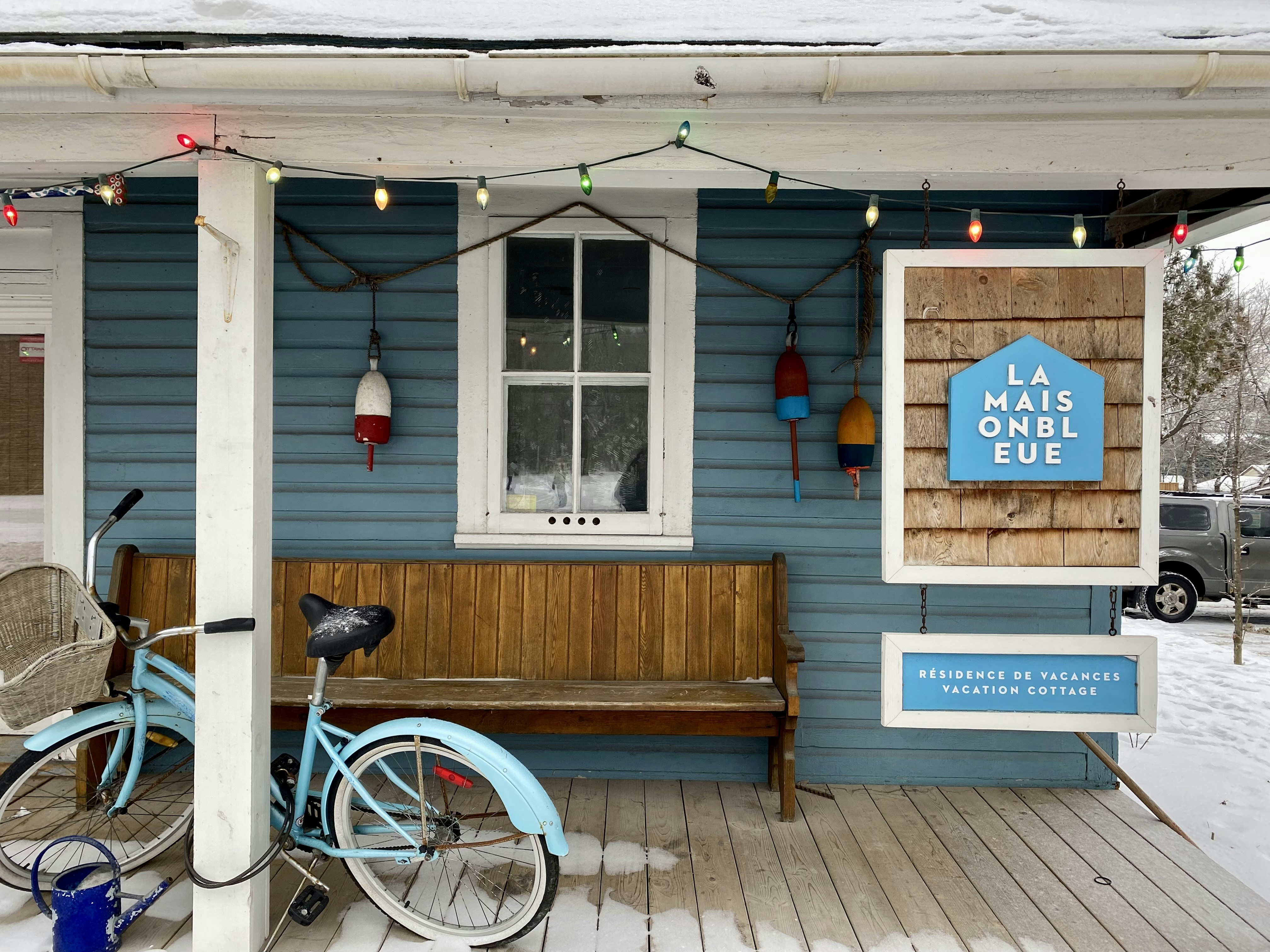a blue bike parked in front of a blue building