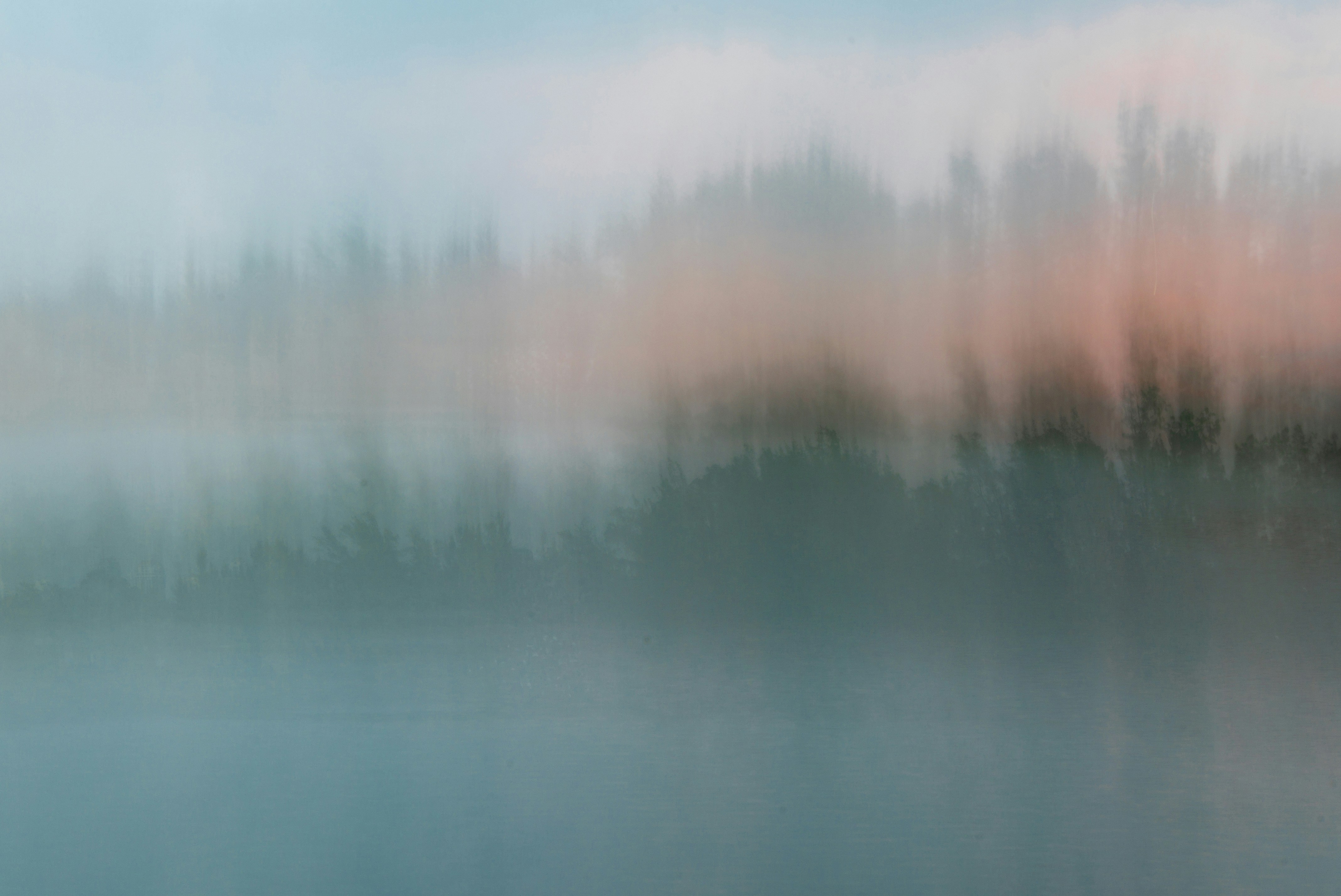 a blurry photo of a body of water with trees in the background, ICM Photography (intentional Camera Movement) is an abstract style of shooting that has no rules – it all comes down to moving your camera over a long exposure.