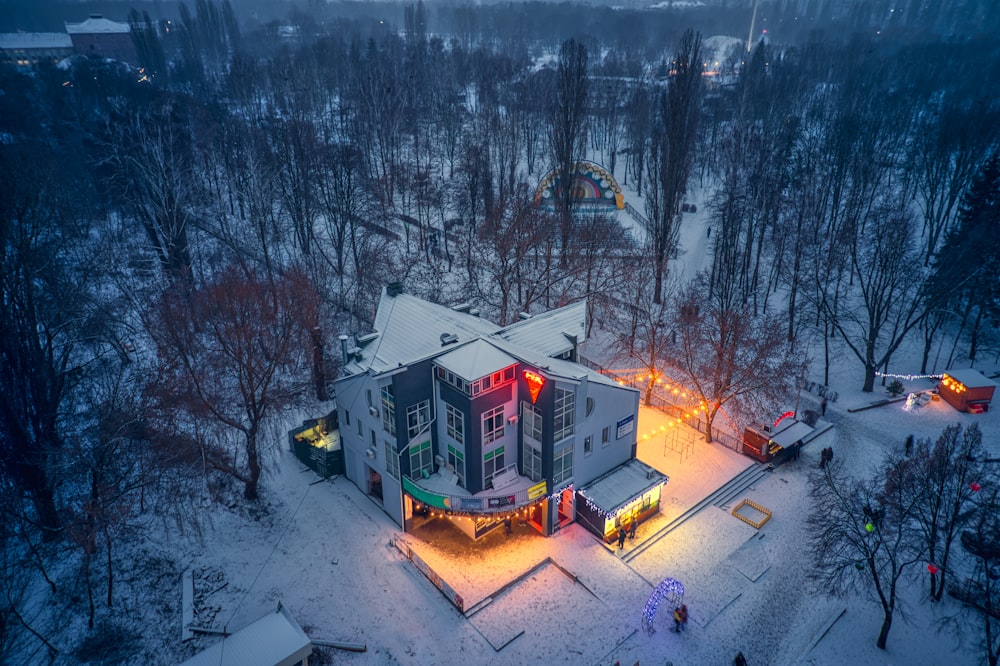 an aerial view of a house in the snow