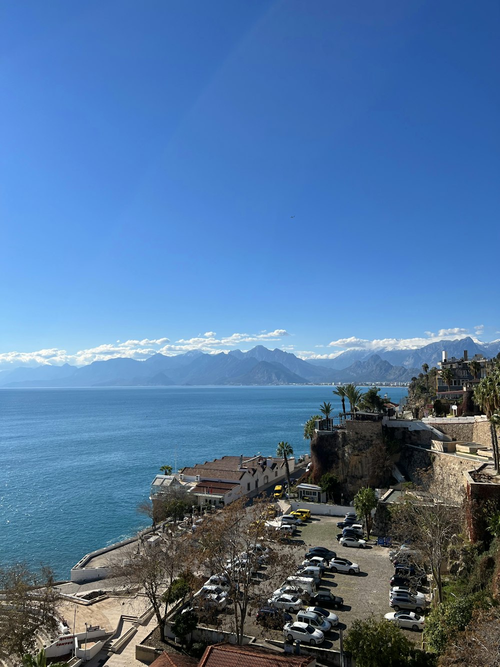 a parking lot next to a body of water