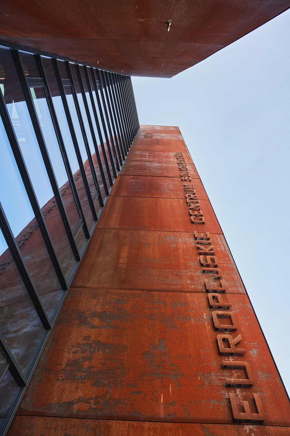 a tall building with a sign on the side of it