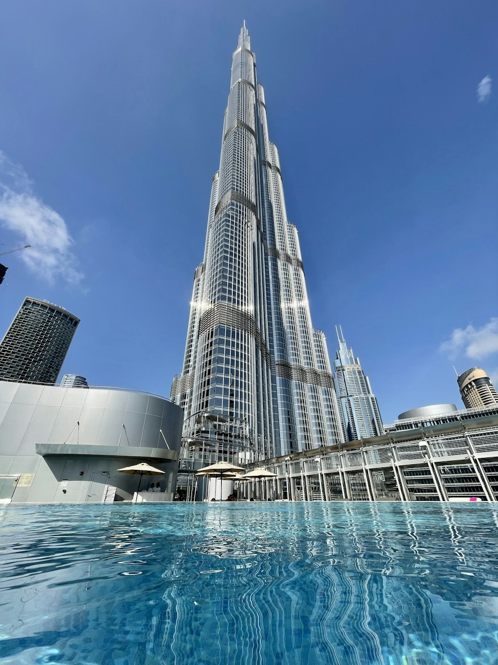 a very tall building towering over a body of water