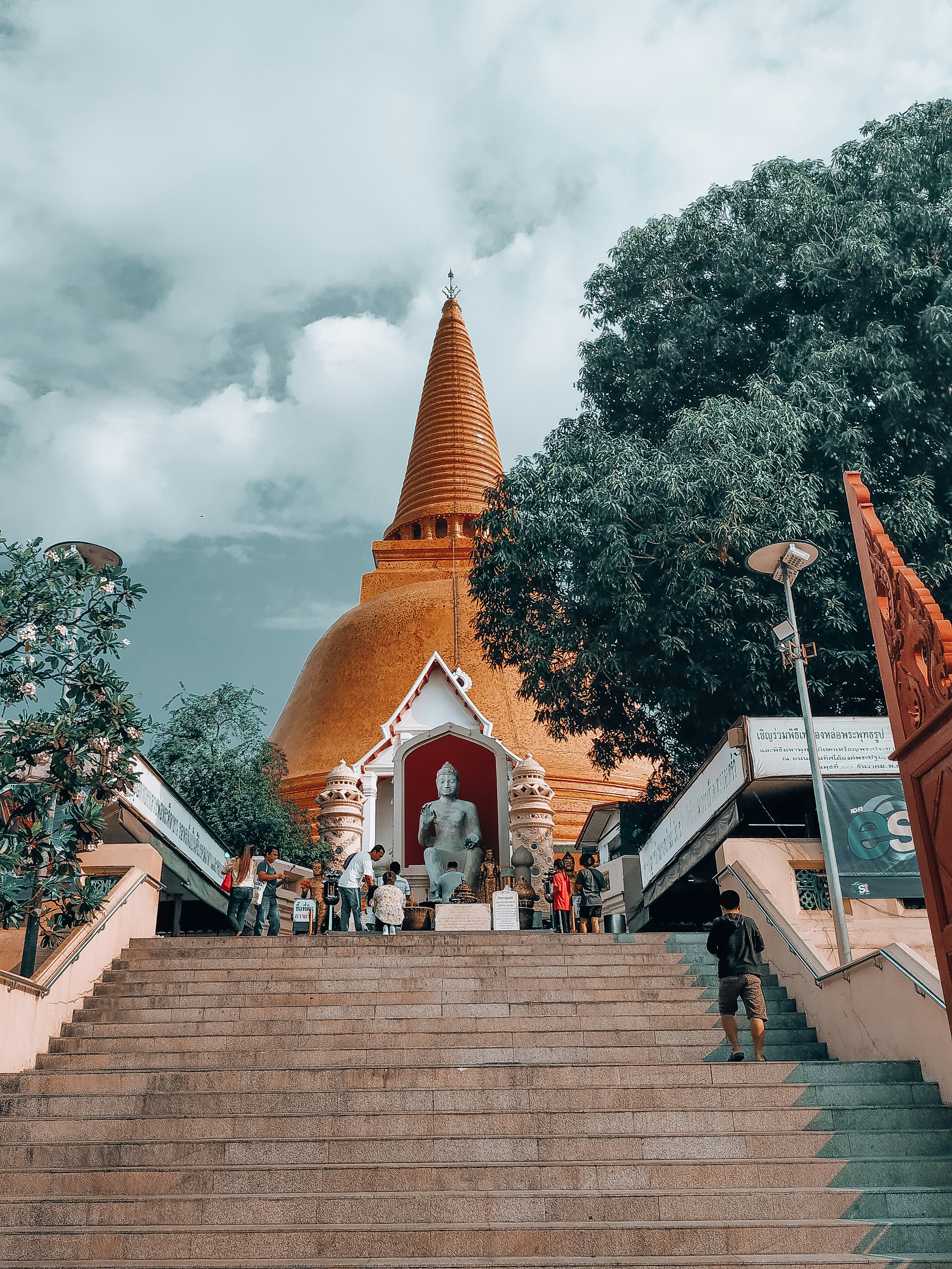 a group of people walking up and down a set of stairs