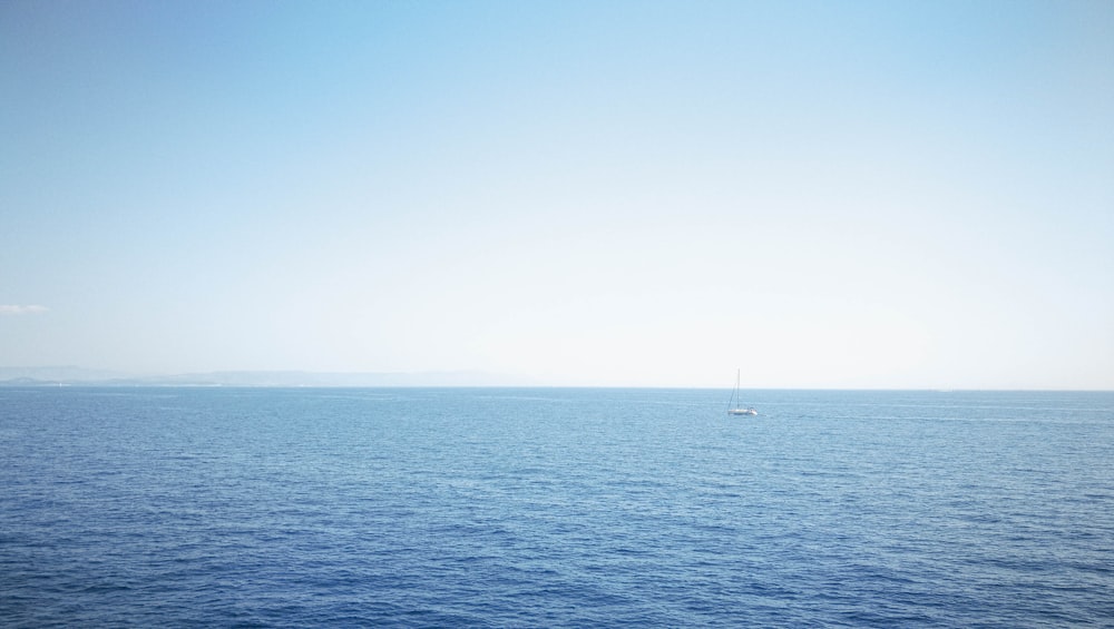 a sailboat in the middle of a large body of water