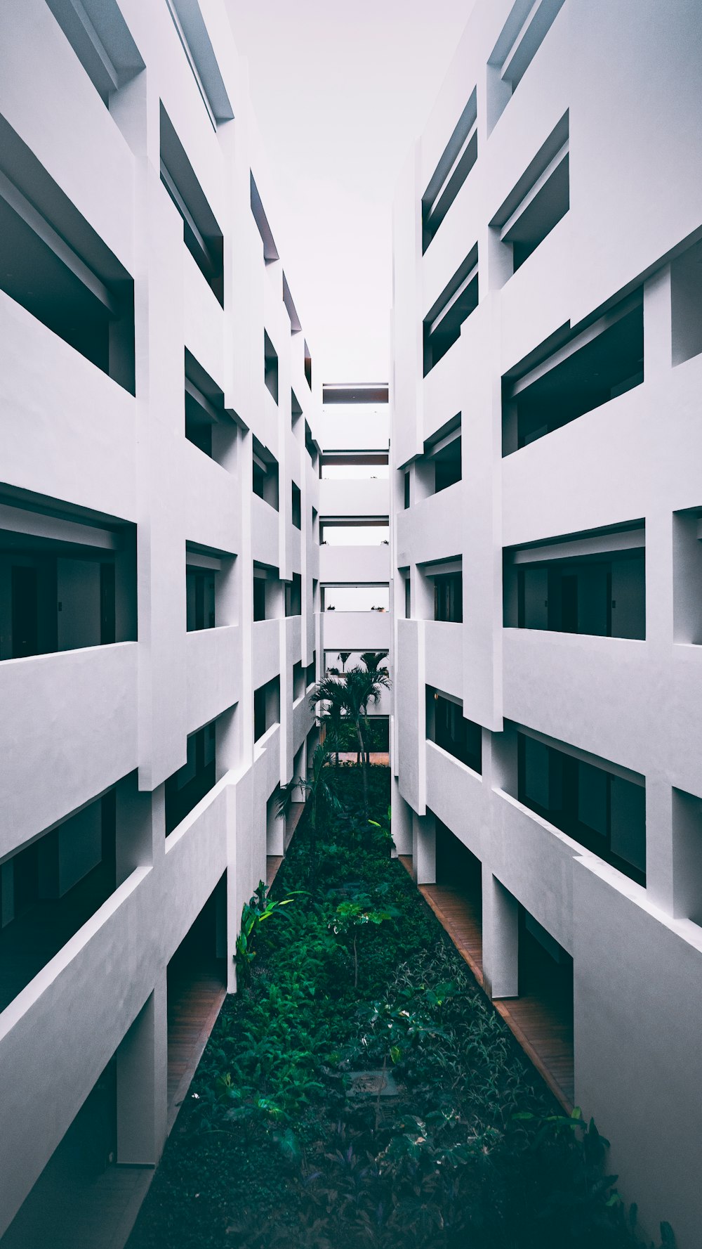 a white building with several balconies on the side of it