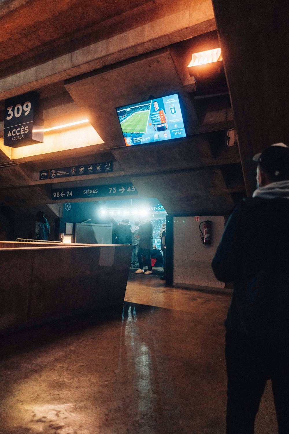 a man is standing in a subway station