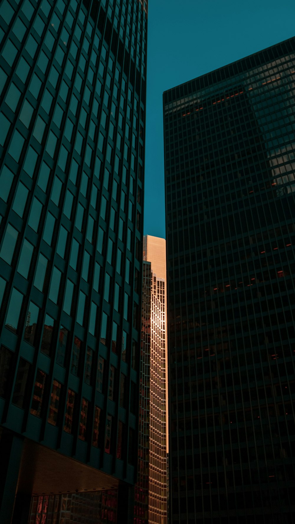 a couple of tall buildings next to each other