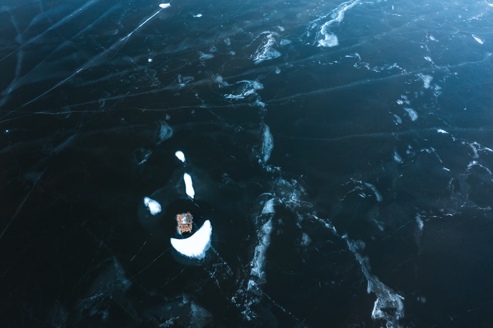 an aerial view of a boat in the water