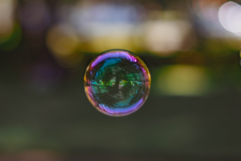 a close up of a soap bubble with a blurry background
