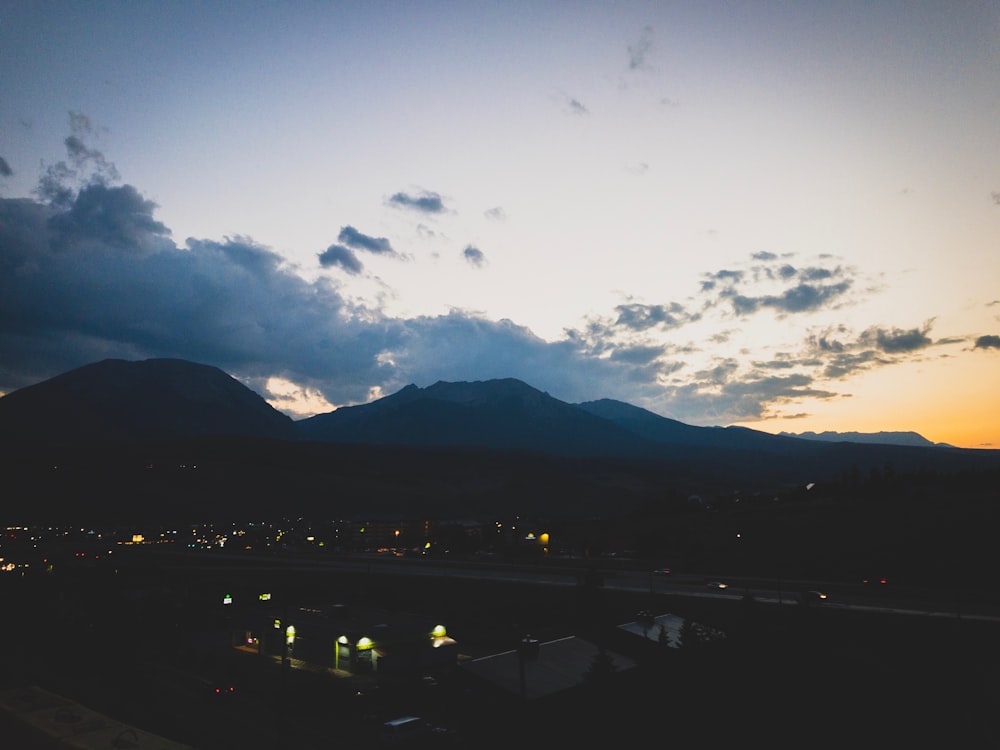 a view of a mountain range at dusk