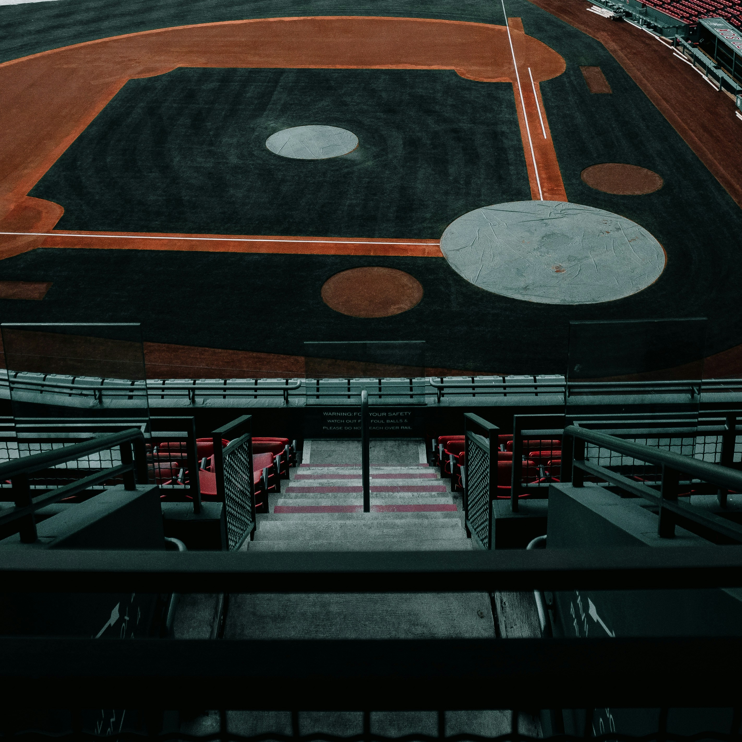 a baseball field with a red and black field