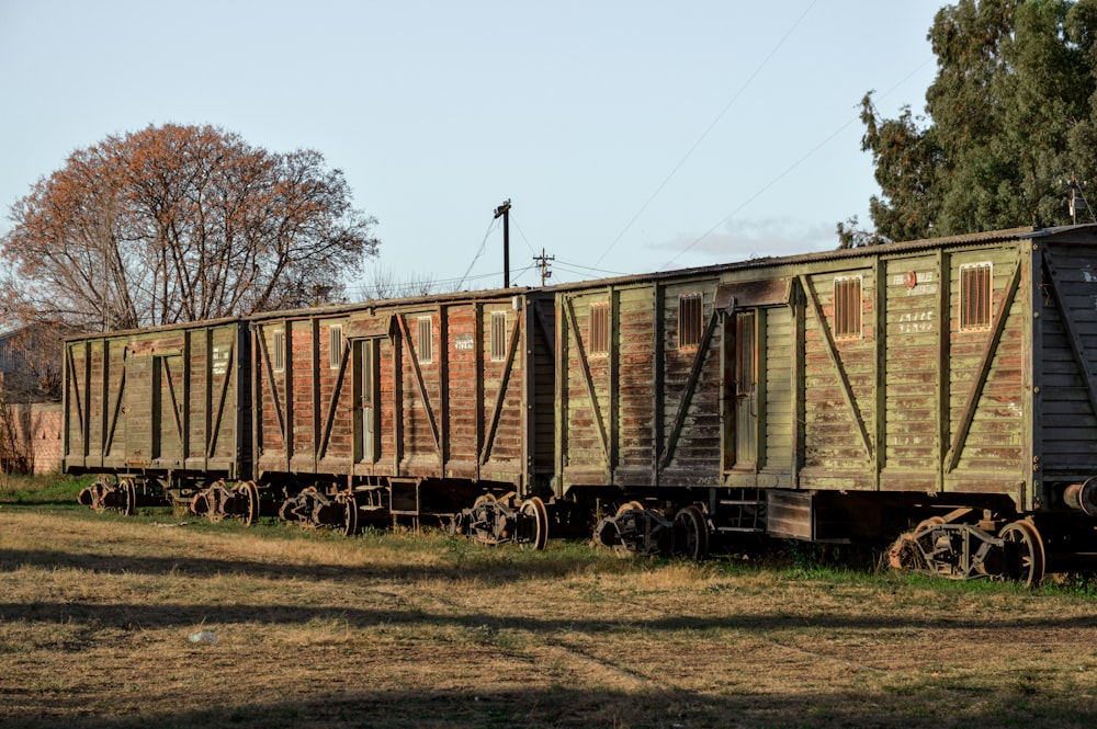 a train car that is sitting in the grass