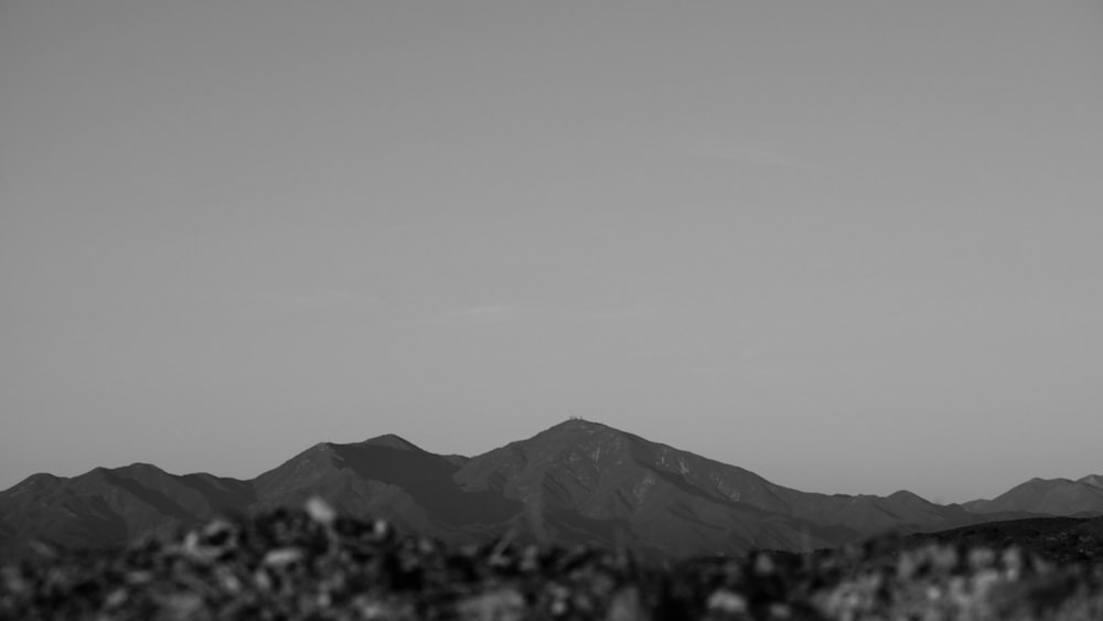 a black and white photo of a mountain range