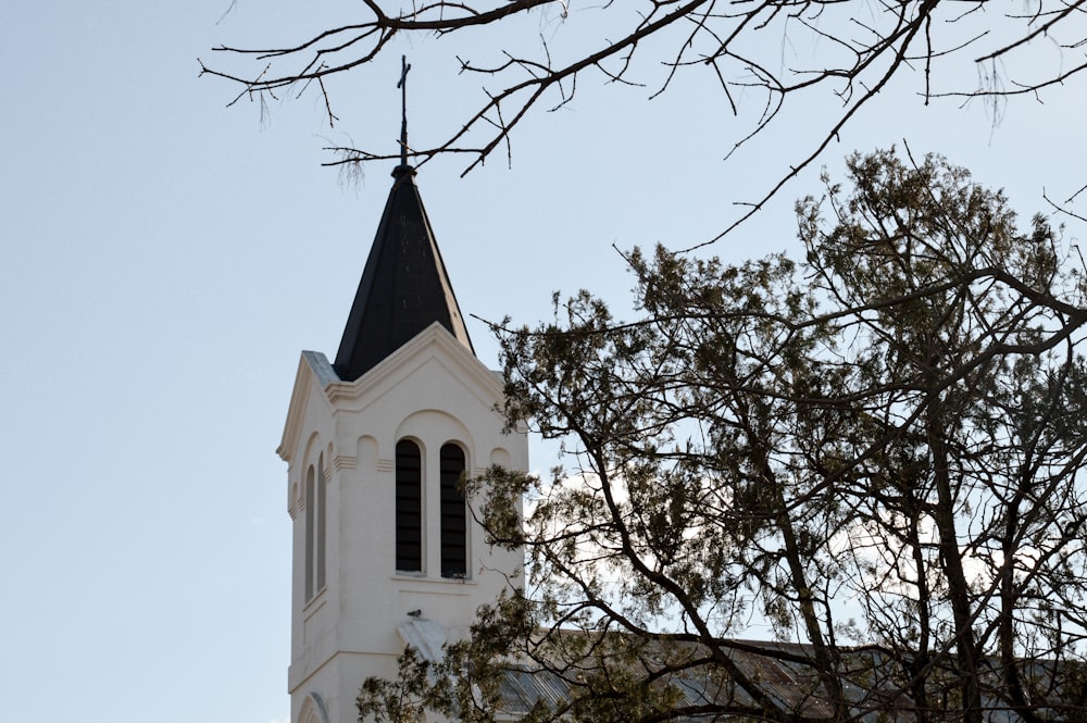 a white church steeple with a black steeple