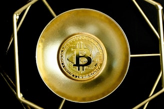 a gold plate with a bitcoin on it