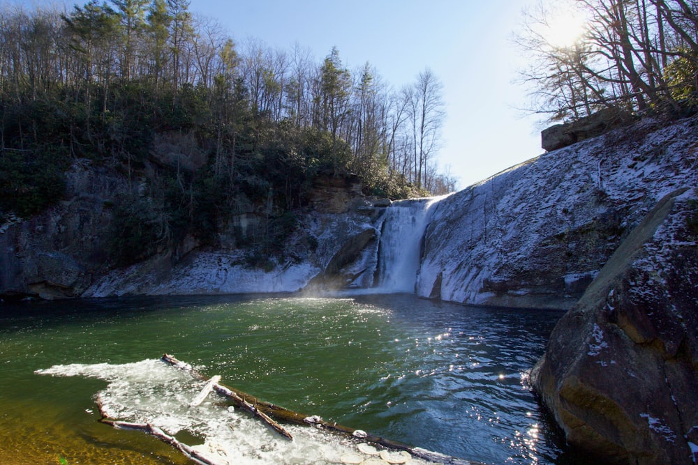 a large waterfall with a small waterfall in the background