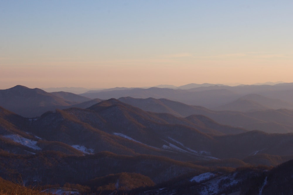 a view of a mountain range at sunset