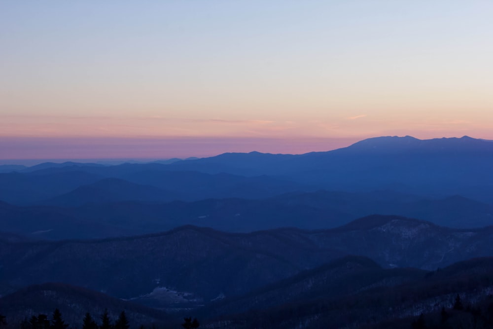 a view of a mountain range at sunset