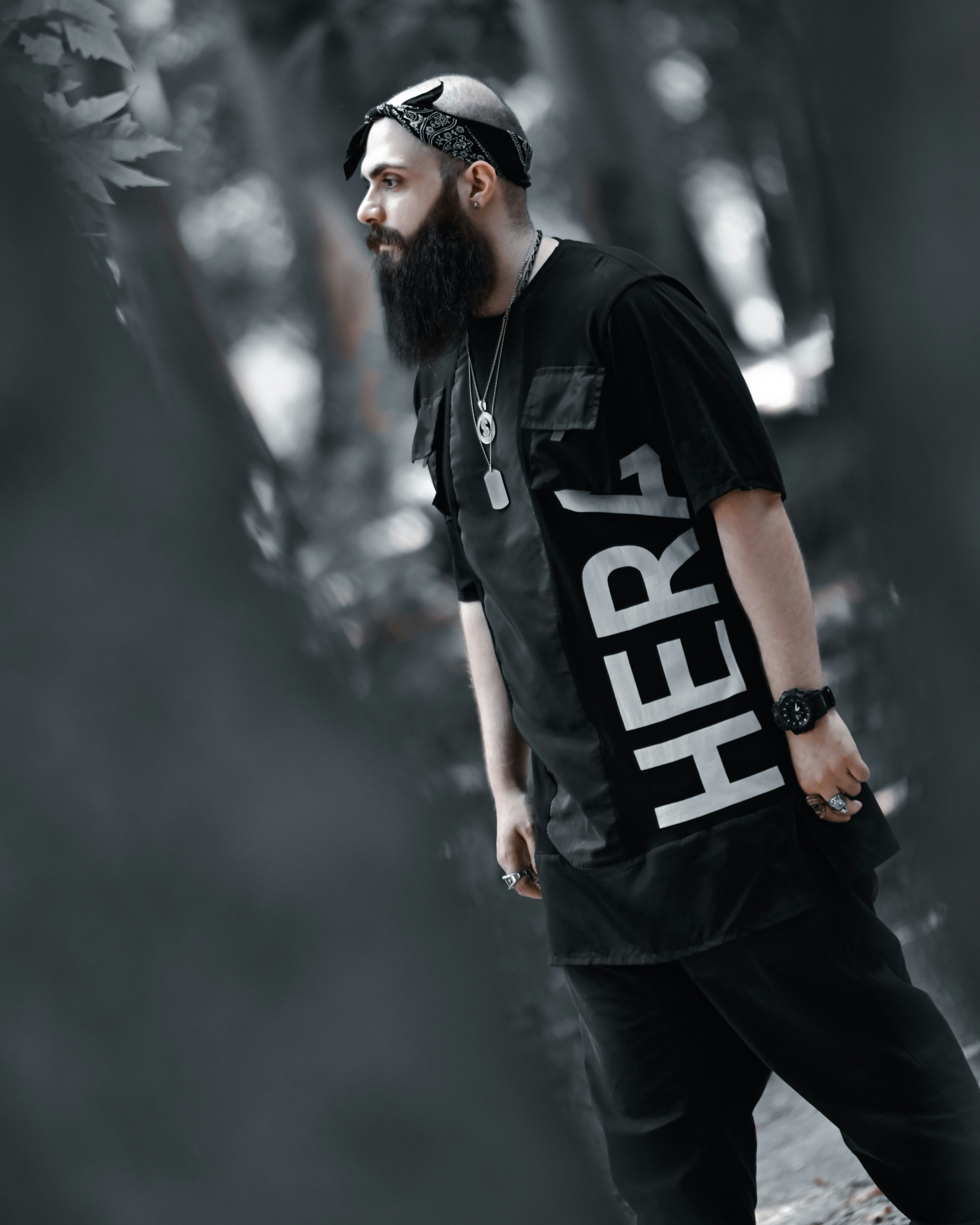 a man with a beard wearing a black shirt