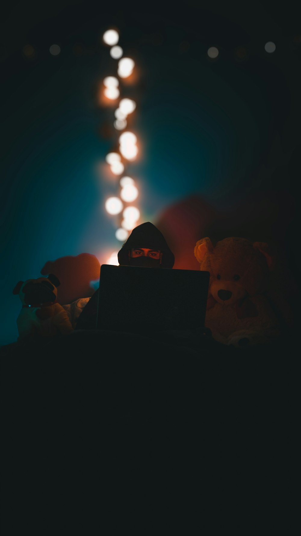 a person sitting in front of a laptop computer