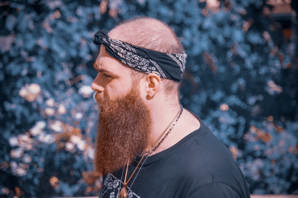 a man with a long beard wearing a bandana