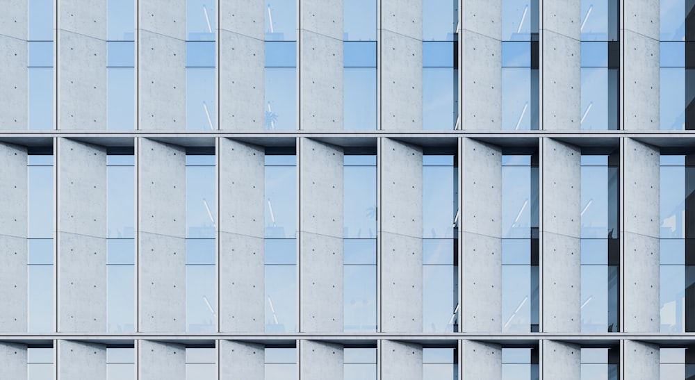 a tall building with lots of windows next to a traffic light