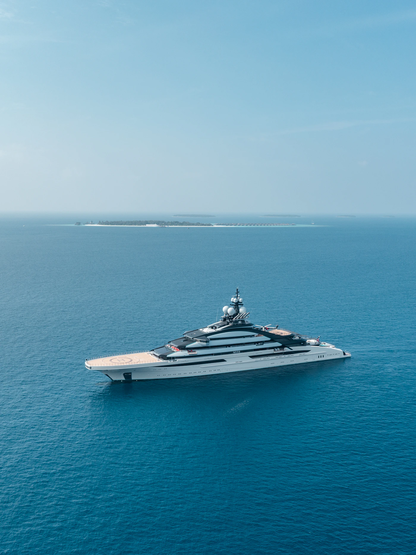 Large white yacht on calm open water