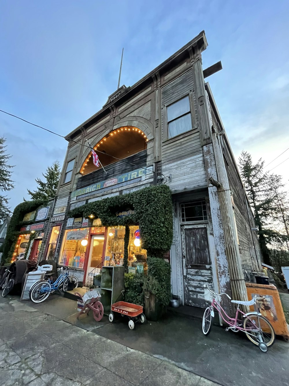 an old building with bicycles parked outside of it