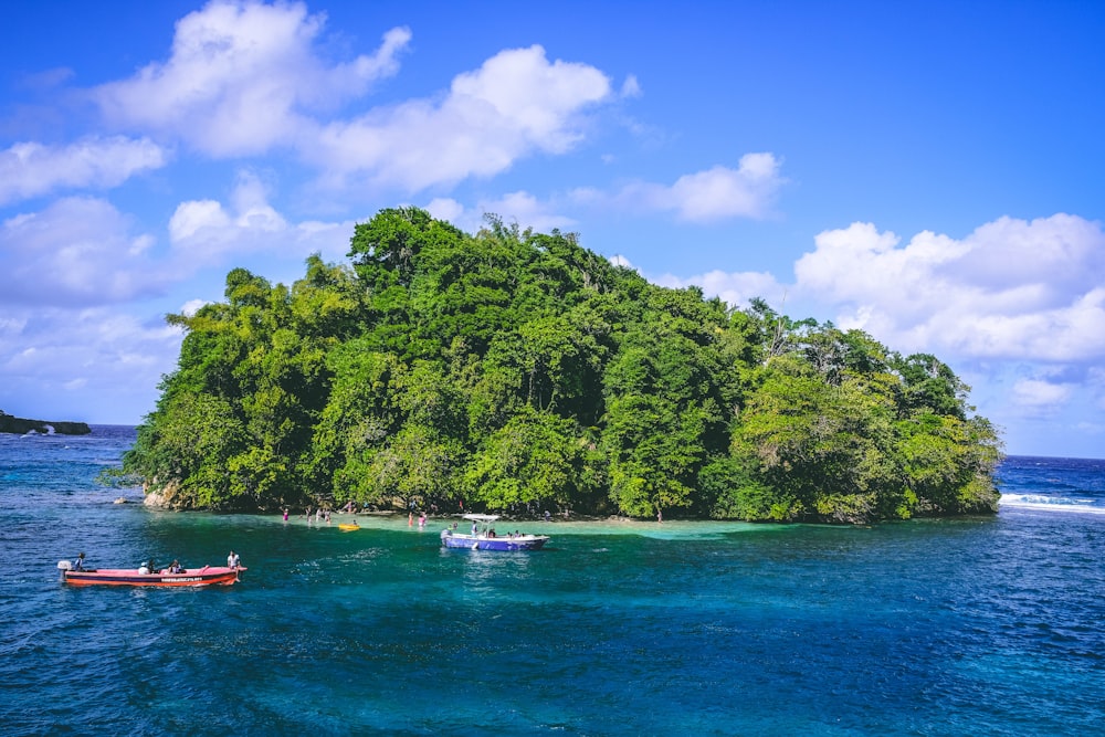 a group of boats floating on top of a body of water