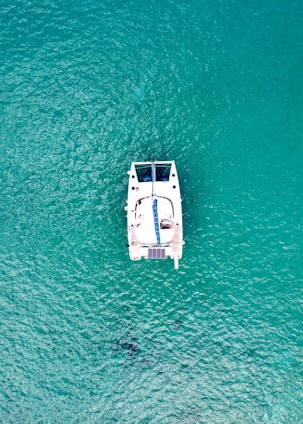 a small boat floating on top of a body of water