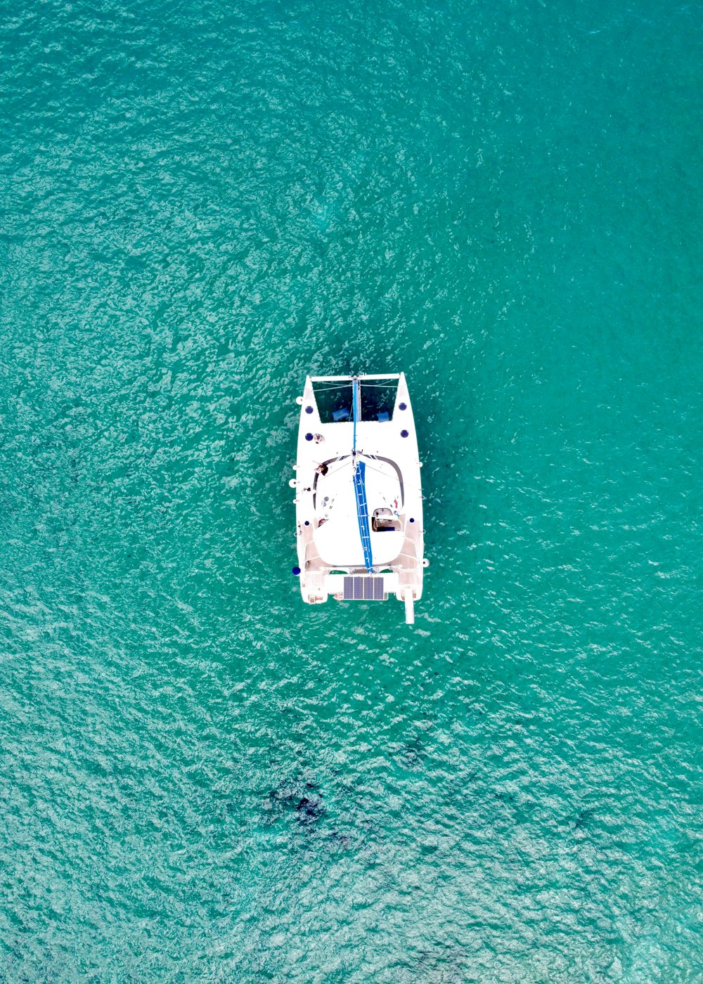 a small boat floating on top of a body of water