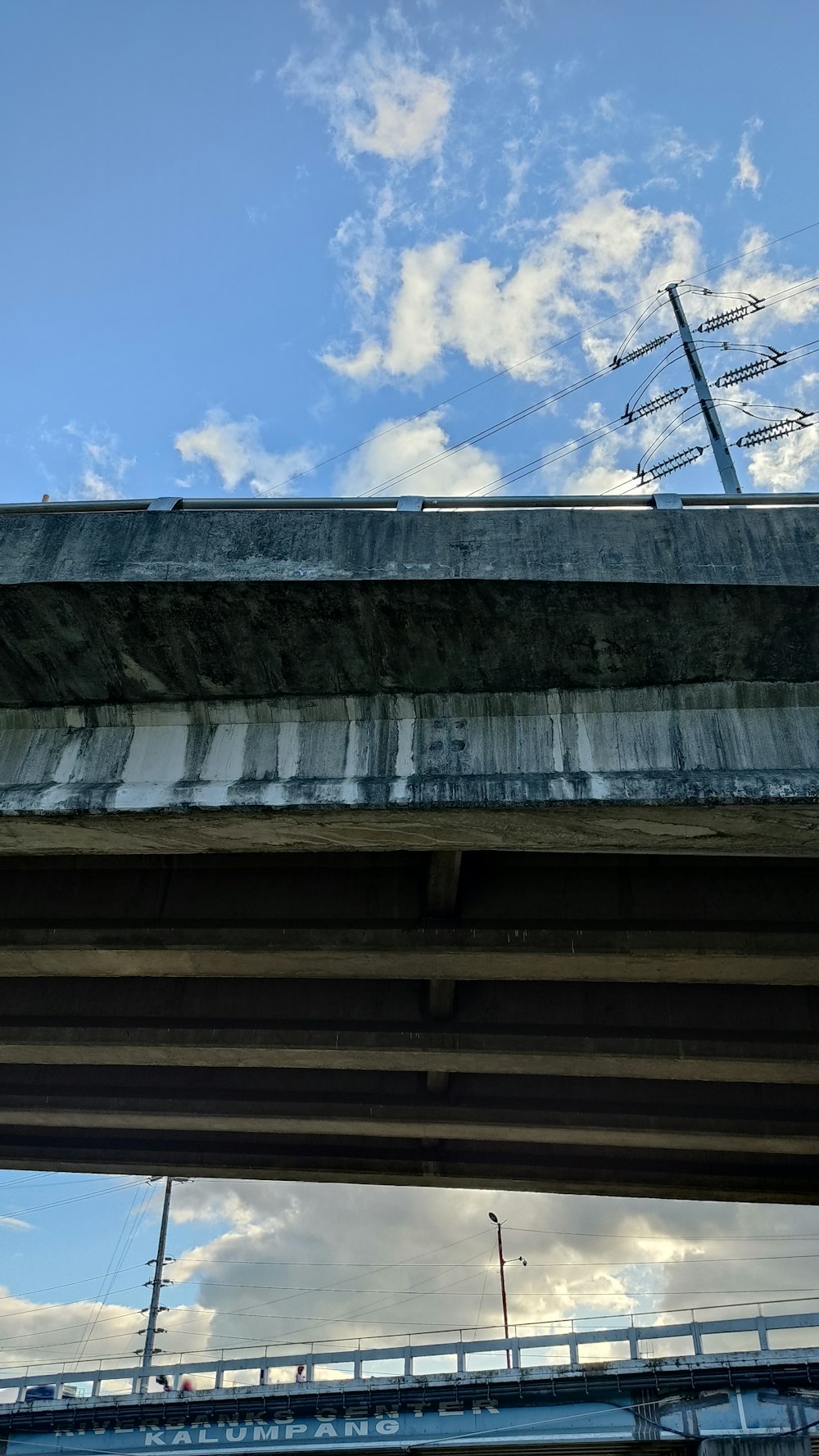 a view of a bridge with a sky in the background