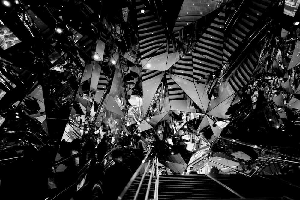 a black and white photo of an escalator