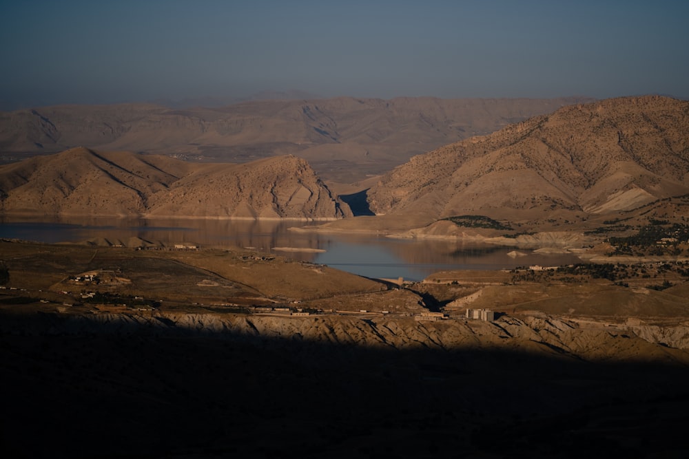 a body of water surrounded by mountains