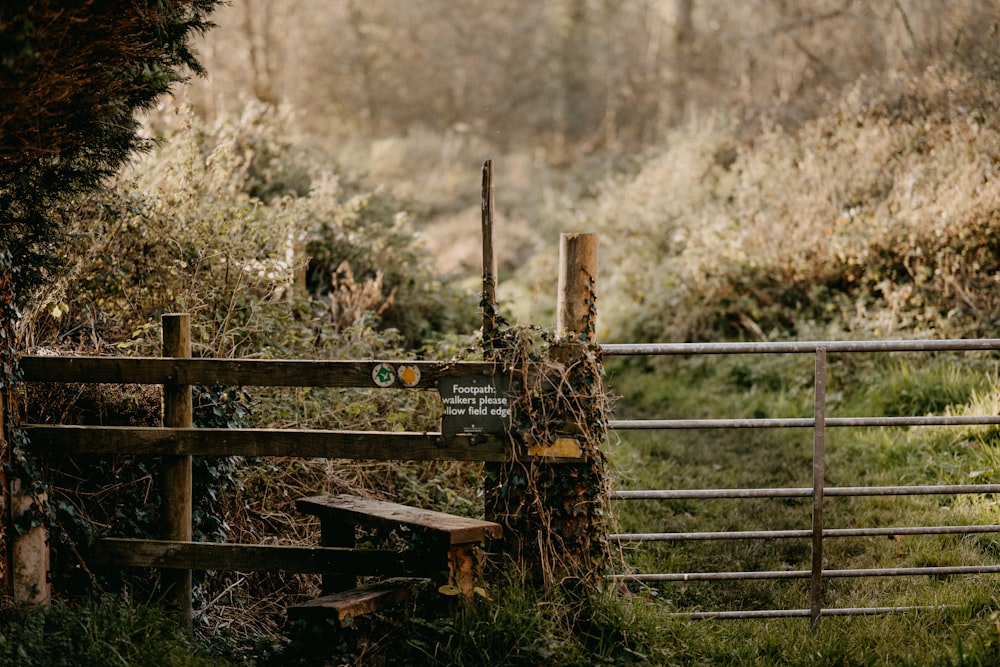 a wooden gate with a sign on it