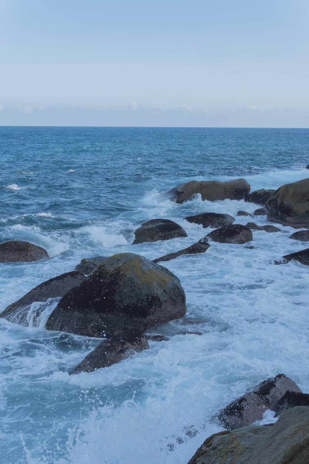 a bunch of rocks that are in the water