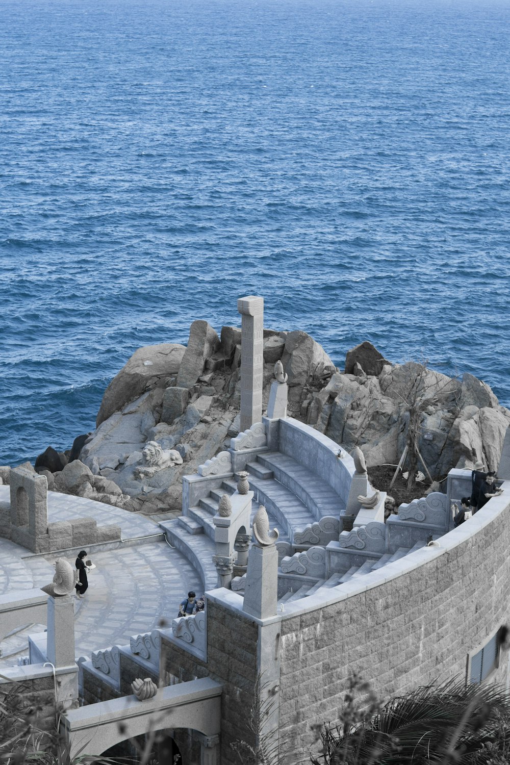 a view of the ocean from the top of a building