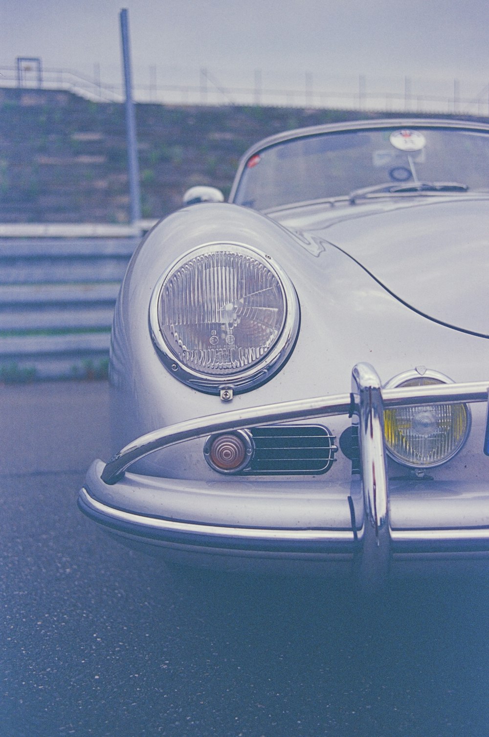 the front end of a silver sports car