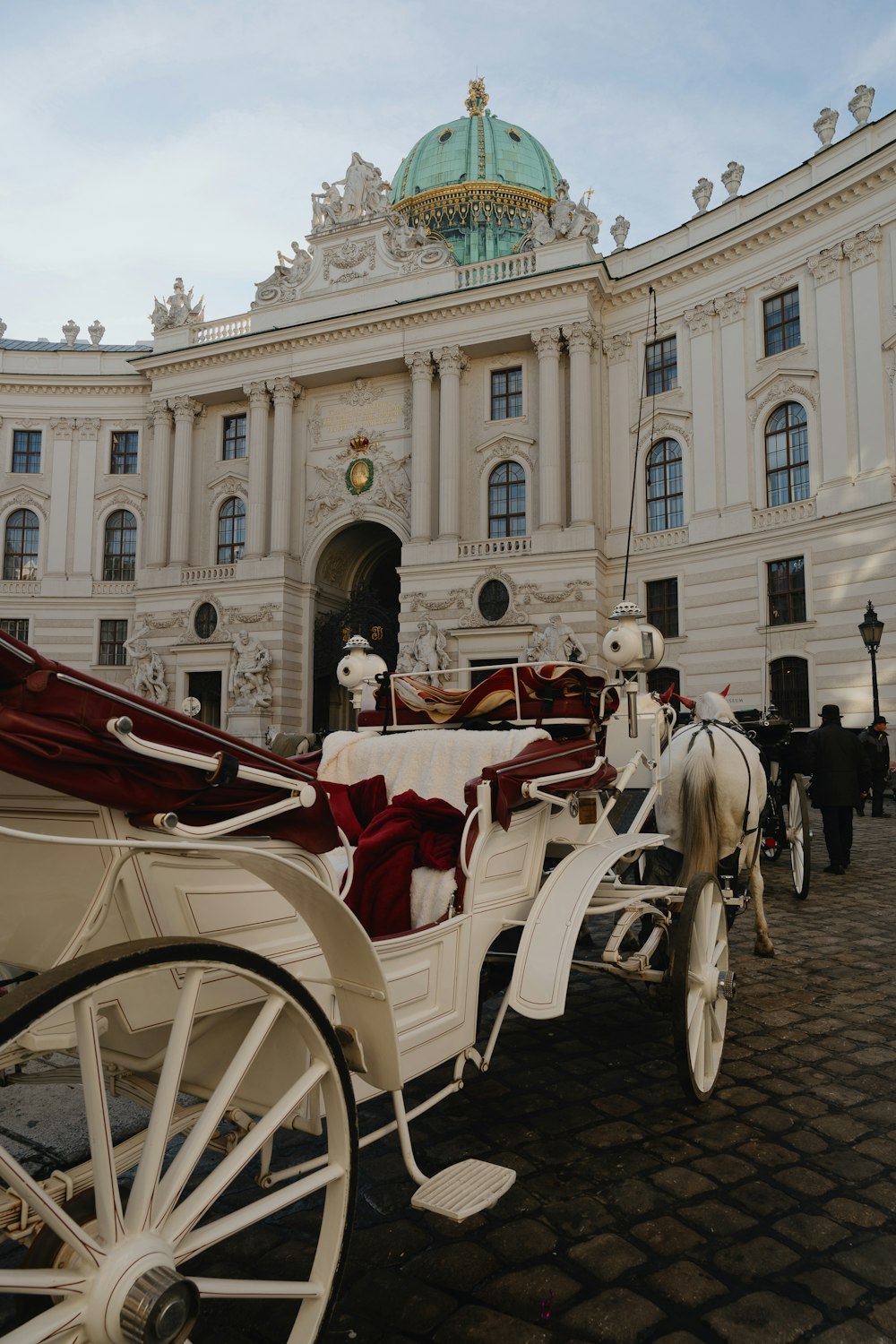 a horse drawn carriage parked in front of a building